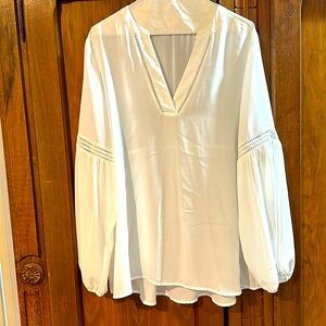Loose white flowy blouse with detailing